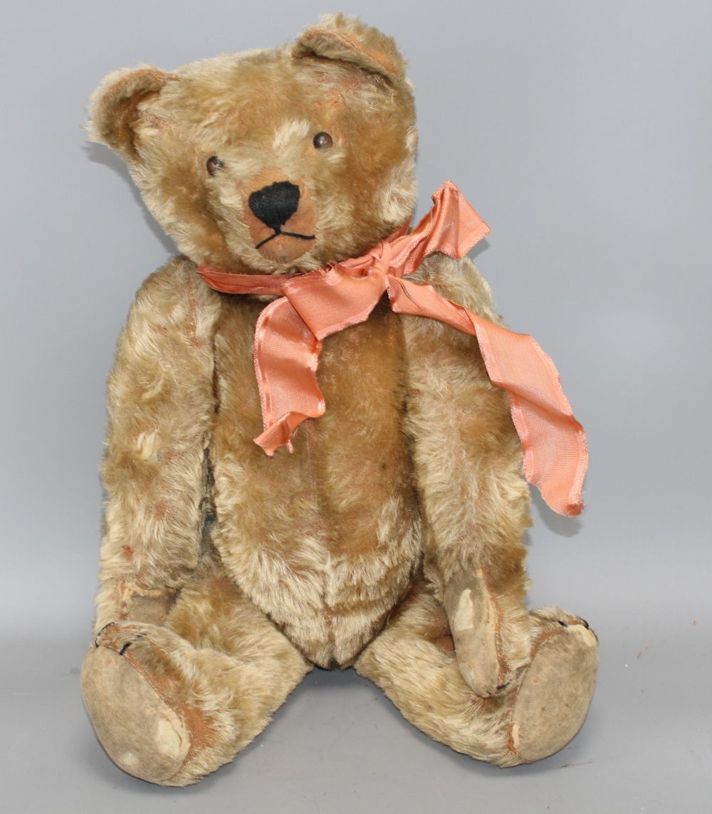 An unusual early bear, c.1920, 24in., button eyes, repairs of paw pads, some hair loss